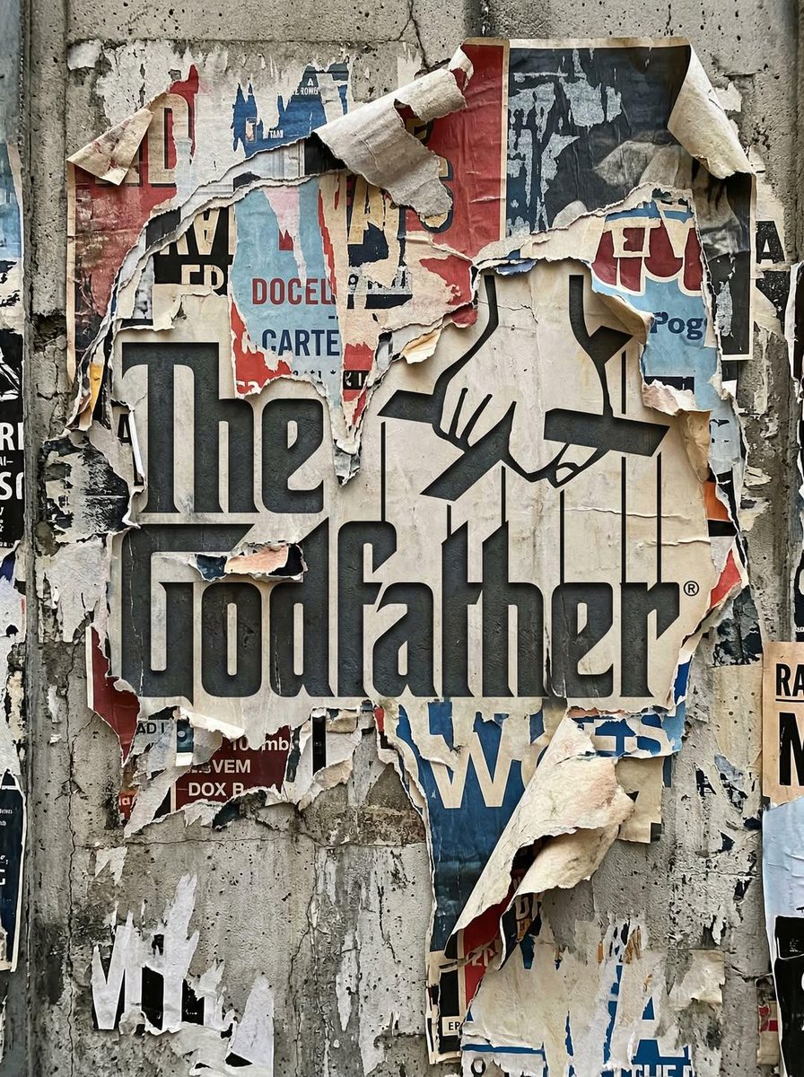 Torn Poster Logo on a Weathered Urban Wall
